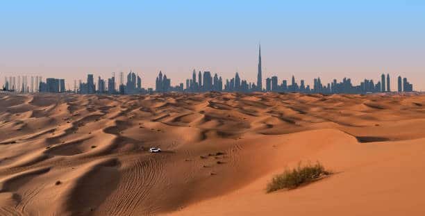 Dubai view with red desert dunes.